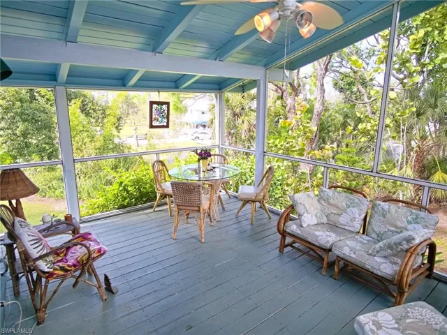 Upstairs screened area also runs down the side of the home to a 2nd balcony, views of the pond and treetops.