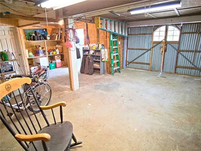 Inside garage, doors closed, workshop rooms not pictured
