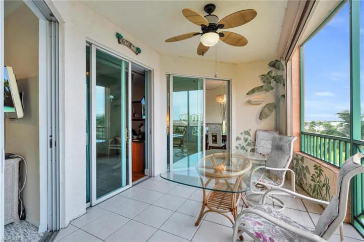 Sunroom featuring ceiling fan