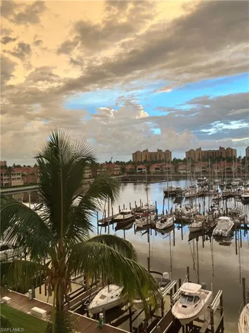 Property view of water with a boat dock