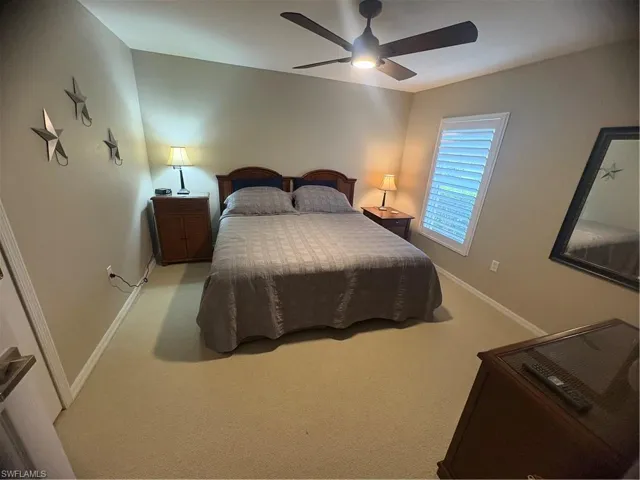 Bedroom with carpet flooring and ceiling fan