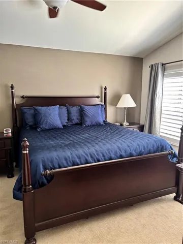 Bedroom featuring carpet flooring and a ceiling fan