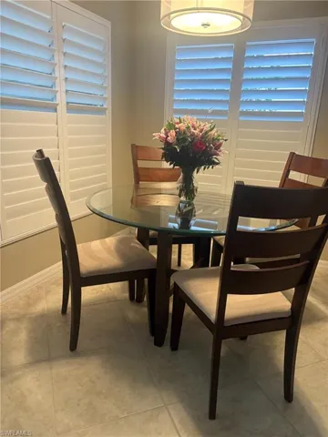 Dining area featuring light tile patterned floors