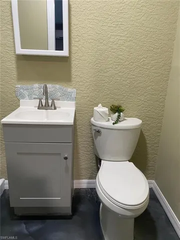 Bathroom with vanity and toilet