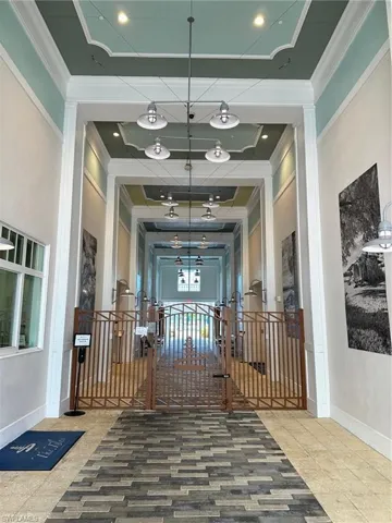 Corridor featuring crown molding
