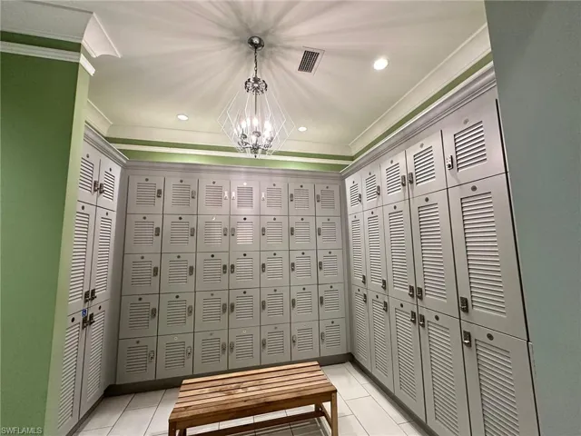 View of home's community featuring a chandelier