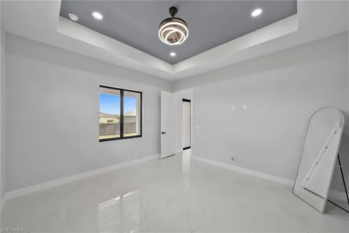 Spare room with a raised ceiling