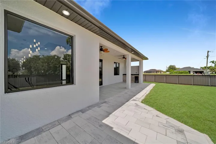 View of patio featuring ceiling fan