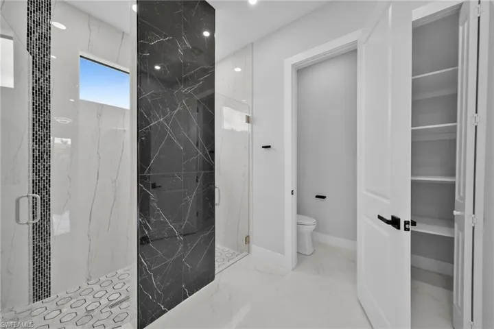 Bathroom with walk in shower and toilet