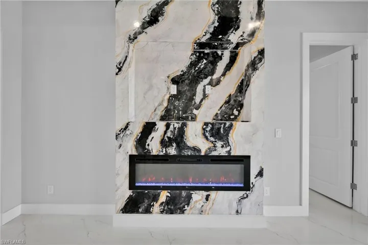 Room details with a high end fireplace