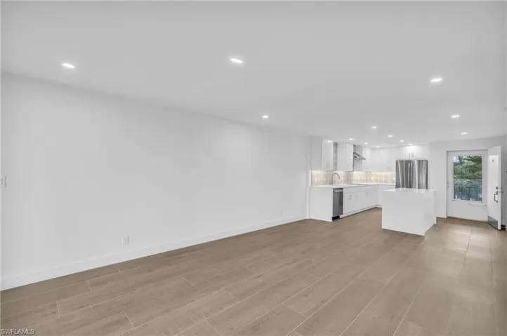 Unfurnished living room featuring recessed lighting and light wood-type flooring