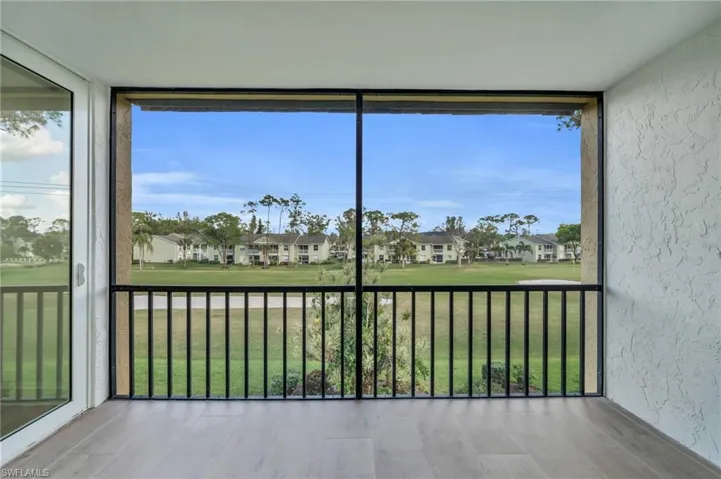 Unfurnished sunroom with golf course view