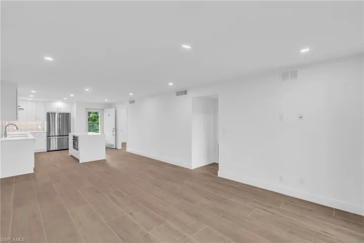 Unfurnished living room featuring recessed lighting and light wood-type flooring