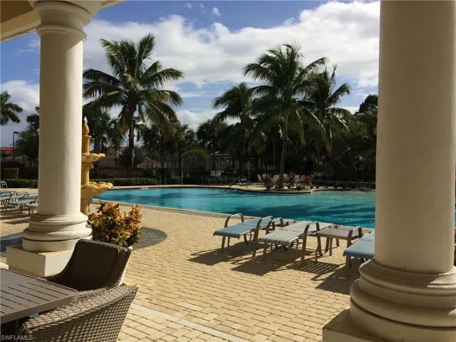 Community pool featuring a patio
