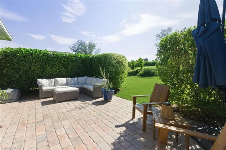 View of patio with an outdoor hangout area