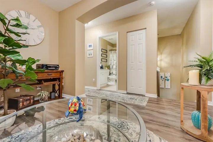 Den with view of upstairs secondary bathroom