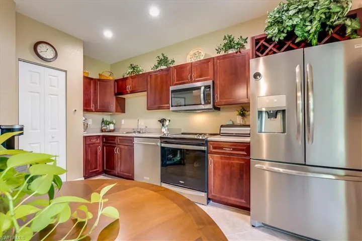 Featuring upgraded appliances (Refrigerator 2019, Stove/microwave/dishwasher 2022) and view of walk in pantry