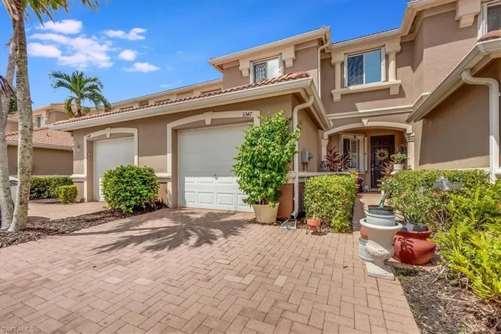 Front of property with 1 car garage and manual storm shutters