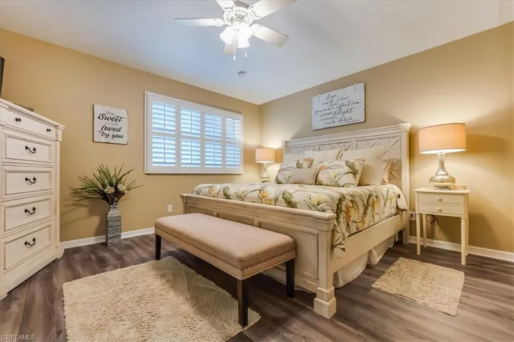 Large primary bedroom with ample space for a king bed and additional furniture
