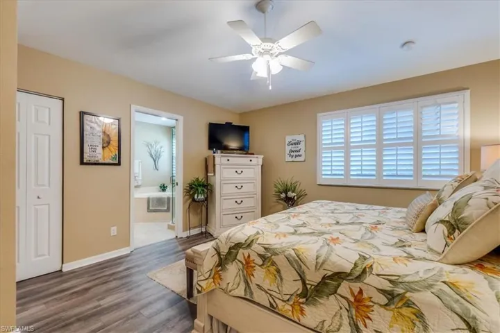Primary Bedroom with view of Bathroom entry and large walk in closet