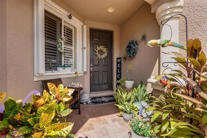 Covered front entry with HOA maintained landscaping