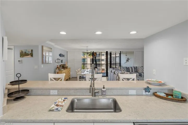Kitchen with sink and ornamental molding