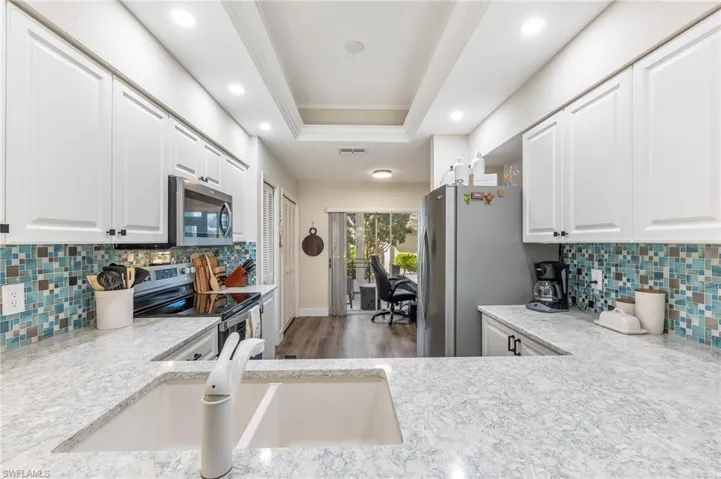 Quartz tiled backsplash white cabinets - very beautiful