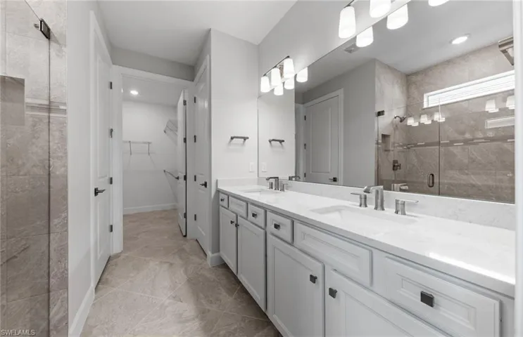 Bathroom with walk in shower and vanity