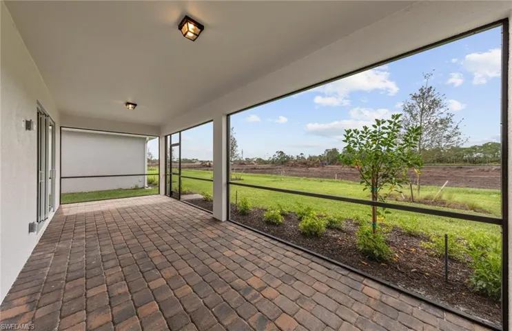 Unfurnished sunroom with a rural view