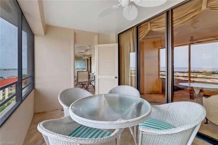 Sunroom with a water view