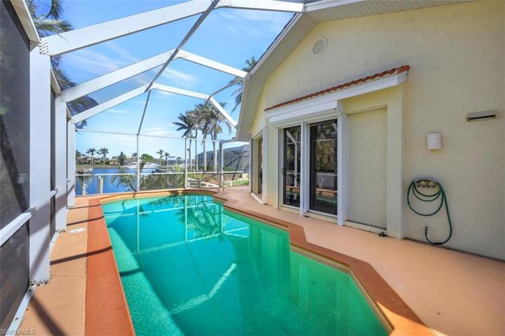 Sunny pool with long water views