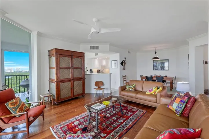 Living room with view into kitchen