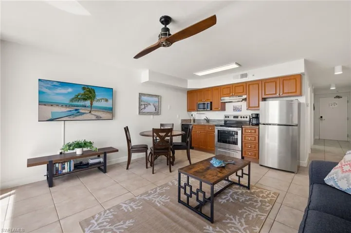 Tiled living room featuring ceiling fan