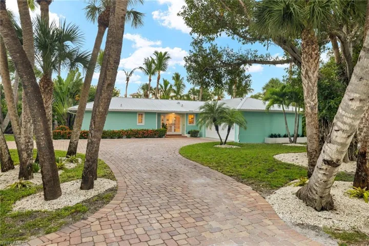 Single story home featuring a front lawn