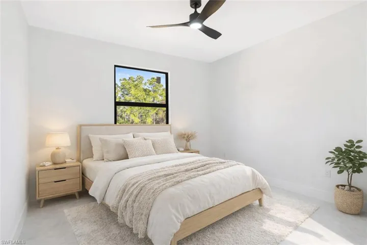 Virtually Staged  Bedroom featuring baseboards and ceiling fan