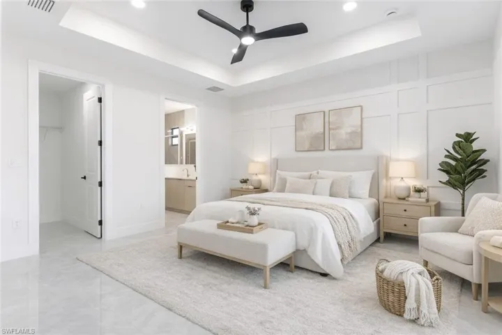 Virtually Staged  Bedroom with a decorative wall, a spacious closet, ceiling fan, a raised ceiling, and recessed lighting