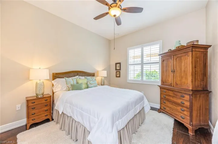 Bedroom featuring hardwood / wood-style flooring and ceiling fan