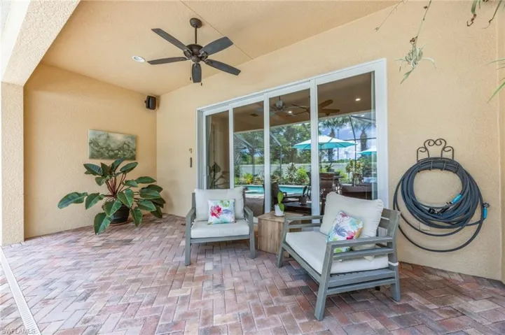 View of patio featuring an outdoor living space and ceiling fan