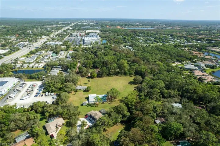 Expansive lot featuring a large cleared area and surrounding mature trees