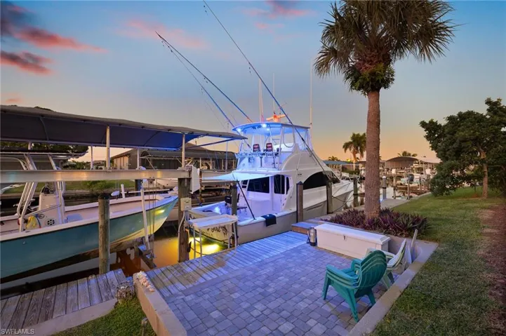 Dock area featuring a water view and boat lift
