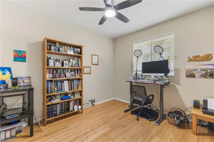 Office featuring light wood finished floors and a ceiling fan