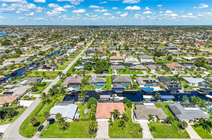 Aerial view of residential area with a nearby body of water