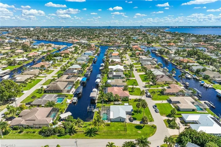 Aerial view of residential area with a nearby body of water