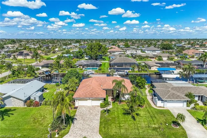 Aerial view of residential area with a large body of water