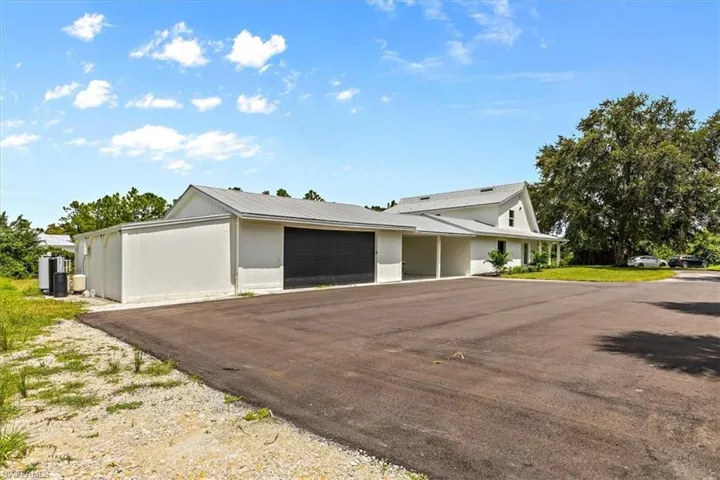 View of front facade featuring a garage