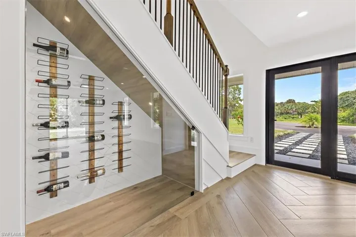 Wine cellar featuring hardwood / wood-style flooring