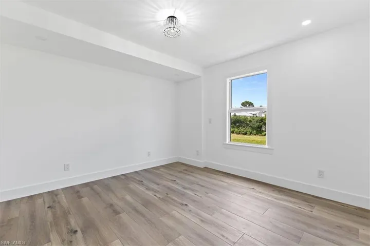 Spare room with light wood-type flooring