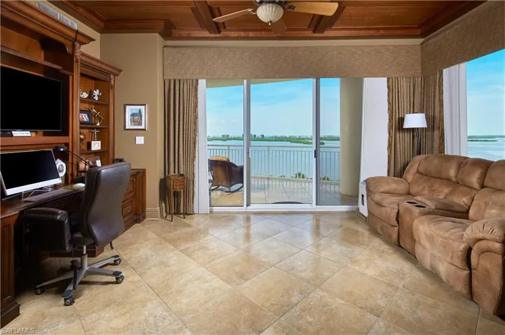 This living space, currently being utilized as a den/home office - opens to a large balcony with the MOST spectacular sunset views!