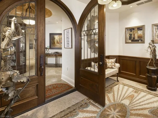 Step off the elevator into your personal lobby. The custom made doors are simply stunning!