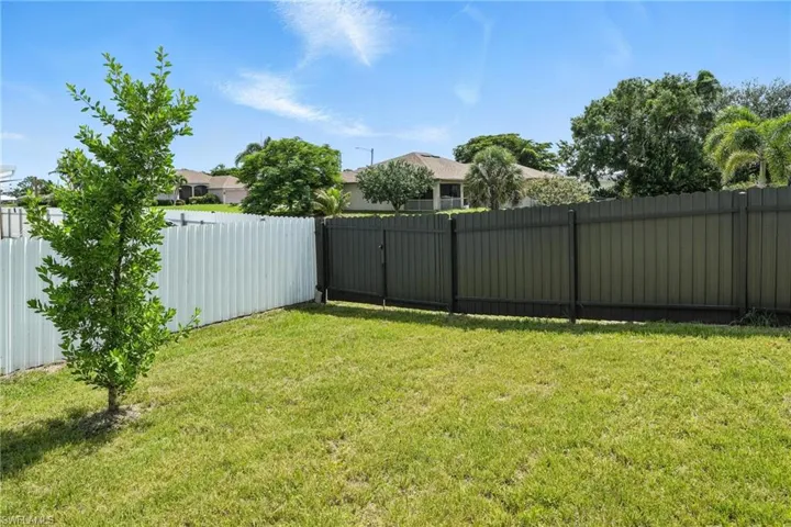 View of fenced backyard